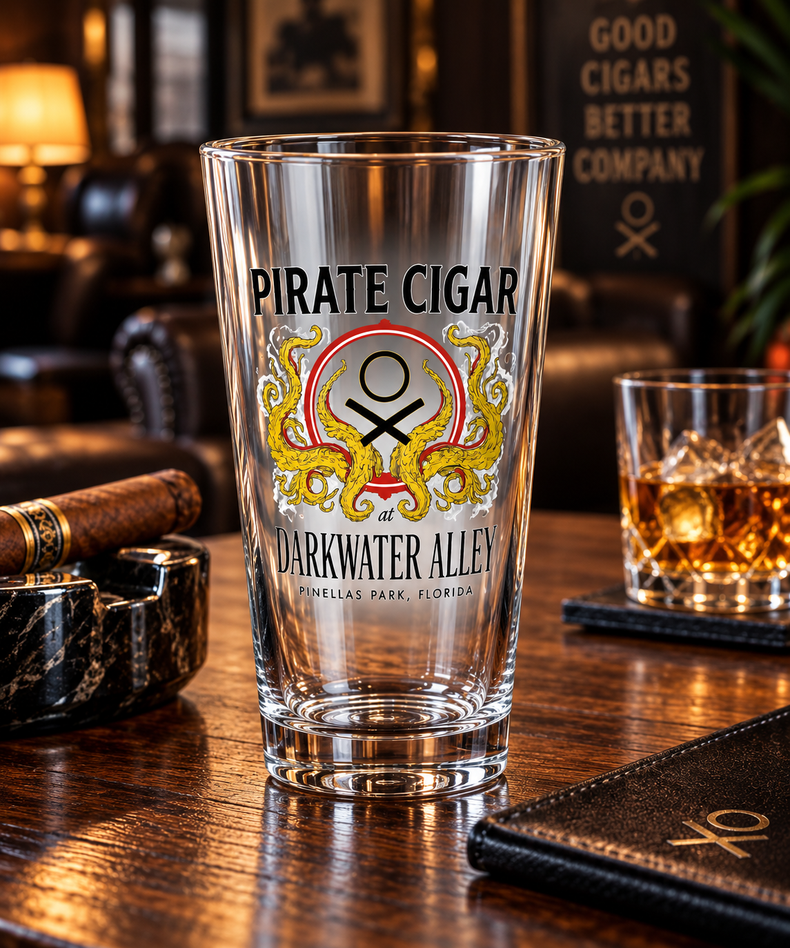 Pirate Cigar at Darkwater Alley kraken crest pint glass with a cigar and whiskey in a lounge