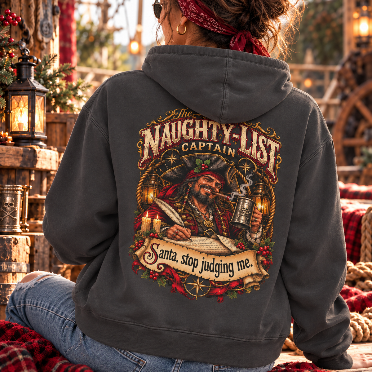 Santa Stop Judging Me pirate Christmas hoodie: Naughty-List Captain crest on the chest and a pirate captain signing the naughty list on the back, Comfort Colors garment-dyed hoodie