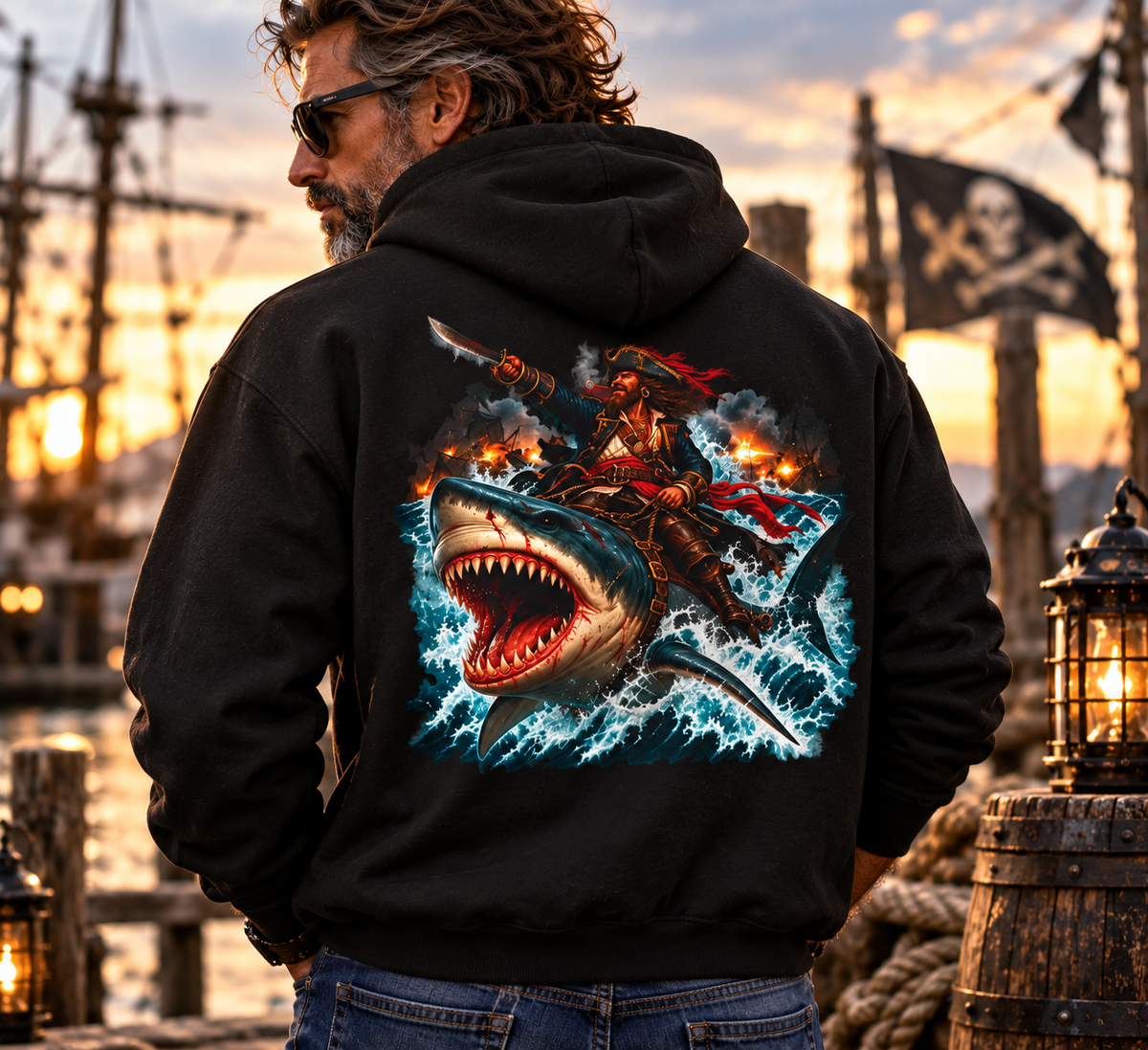 Officer Ashhole Shark Rider Hoodie: a bearded pirate with a lit cigar riding a great white shark through a burning sea battle, printed on a Gildan Softstyle pullover hoodie - alternate view