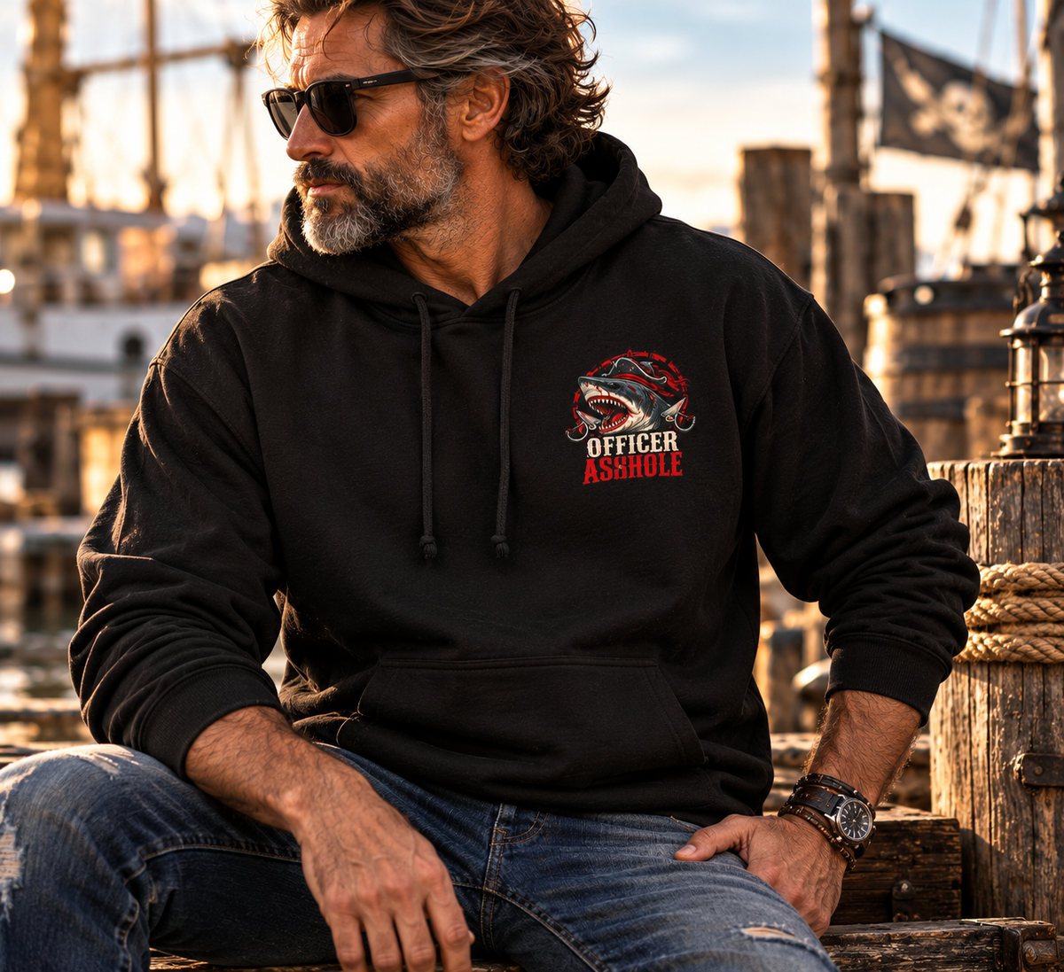Officer Ashhole Shark Rider Hoodie: a bearded pirate with a lit cigar riding a great white shark through a burning sea battle, printed on a Gildan Softstyle pullover hoodie - alternate view