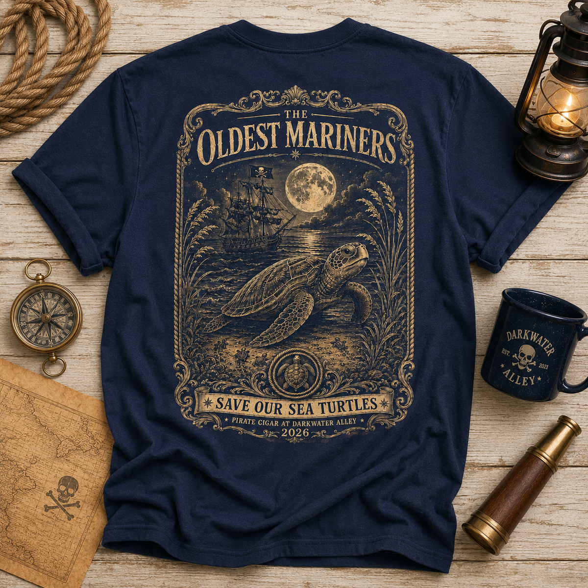 The Oldest Mariners sea turtle t-shirt, back print: a vintage engraving of a loggerhead on a moonlit beach, Save Our Sea Turtles banner, on a navy tee