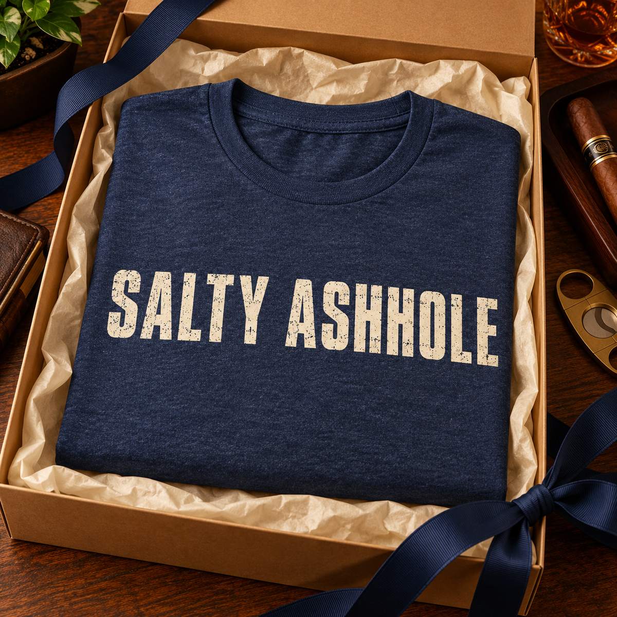 Detail card for the Salty Ashhole tee on a Gildan Ultra Cotton G2000: 6 oz fabric, classic fit, taped shoulders, sizes S to 5XL