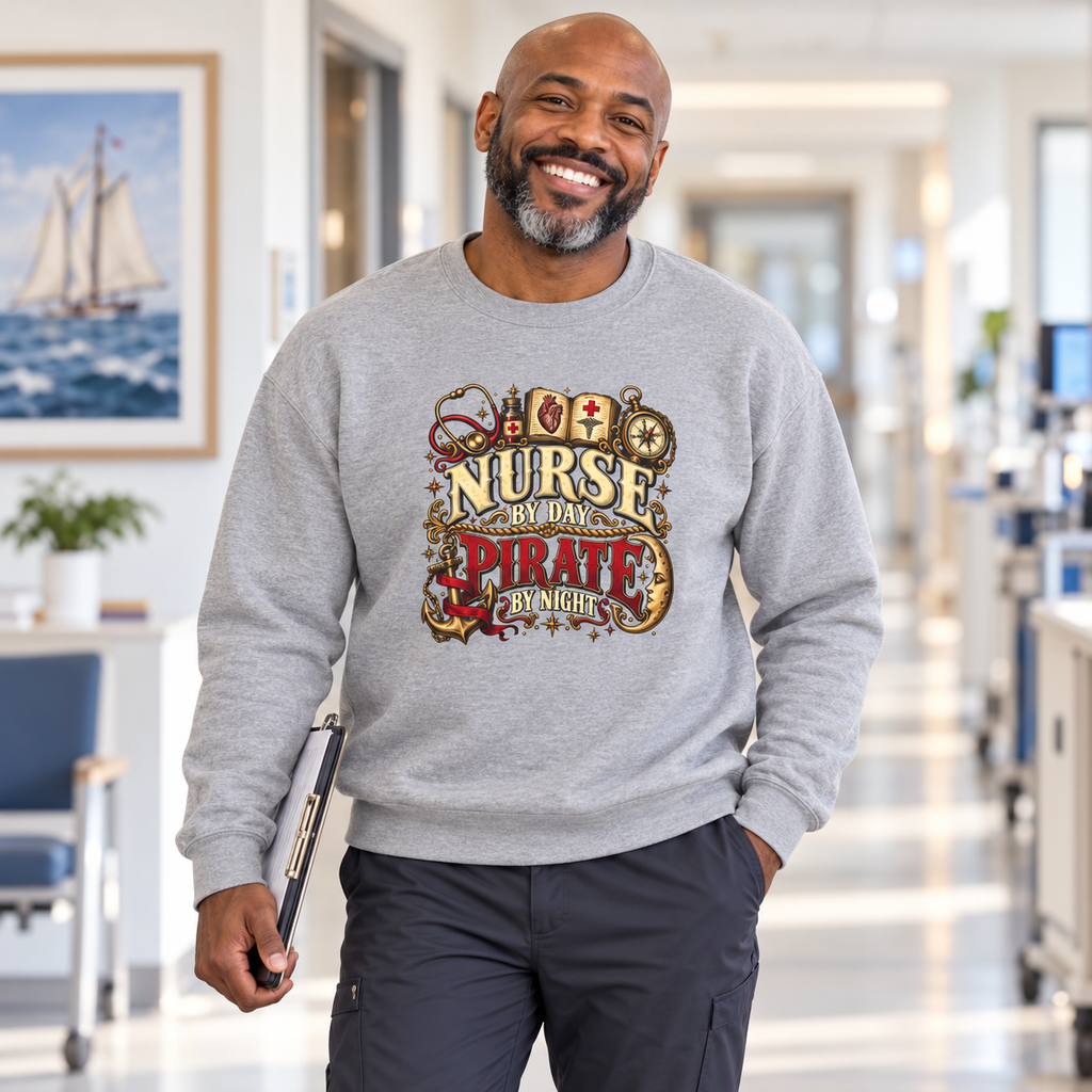 Male nurse in a hospital hallway wearing a sport grey Nurse by Day Pirate by Night sweatshirt